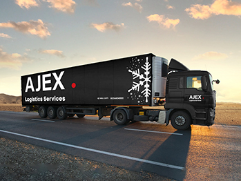 A black truck from AJEX cold chain trailer driving on a road